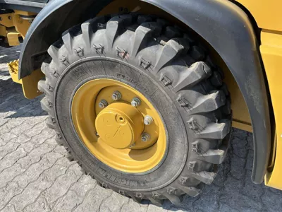 77075