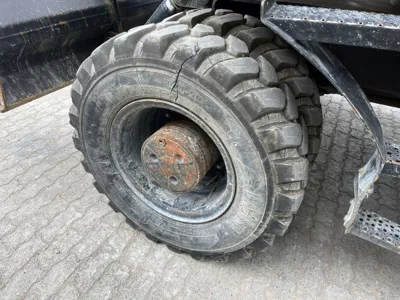 77053